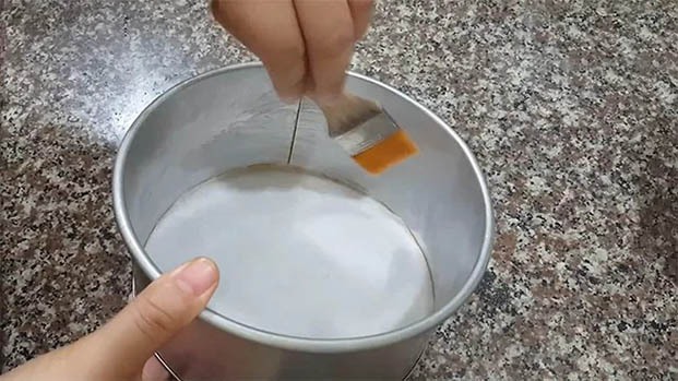 Grease the sponge cake pan with butter